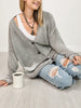 Long Sleeve Cardigan with Button Front and Distressed Hem