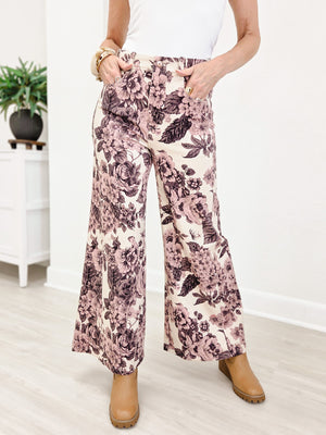 Wide Leg Pants Featuring Front Pockets With A Light Floral Design
