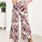 Wide Leg Pants Featuring Front Pockets With A Light Floral Design