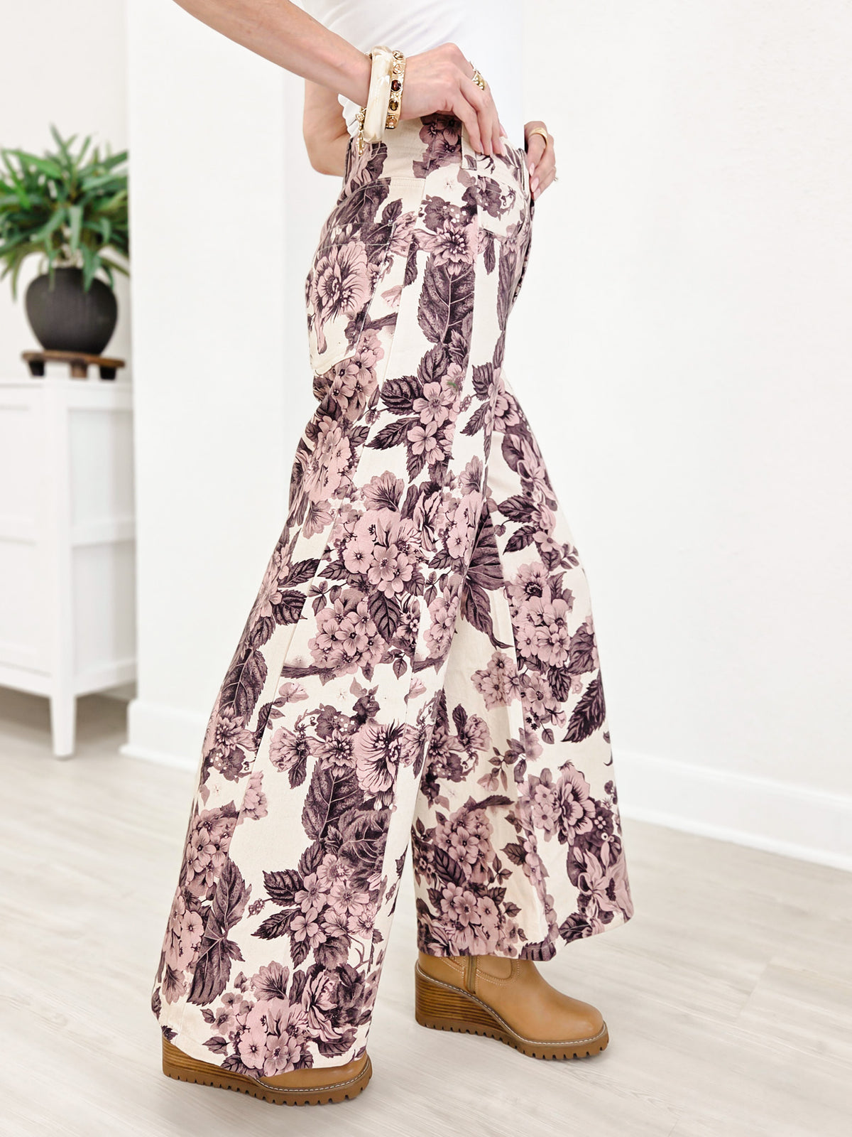 Wide Leg Pants Featuring Front Pockets With A Light Floral Design