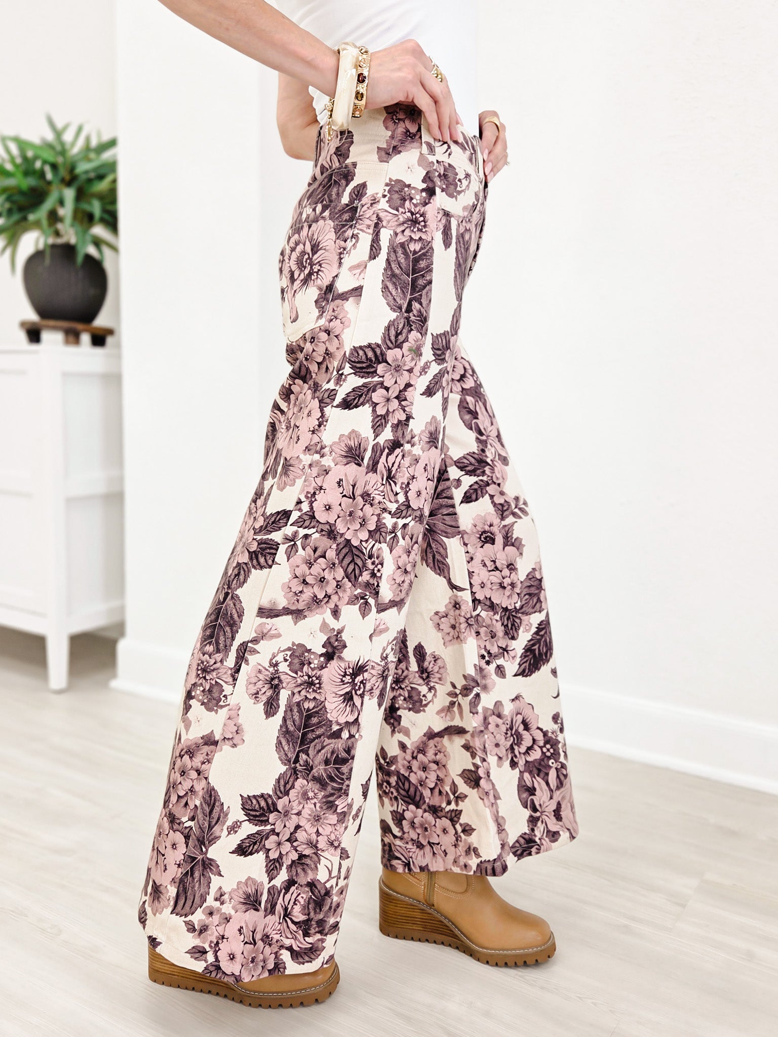 Wide Leg Pants Featuring Front Pockets With A Light Floral Design
