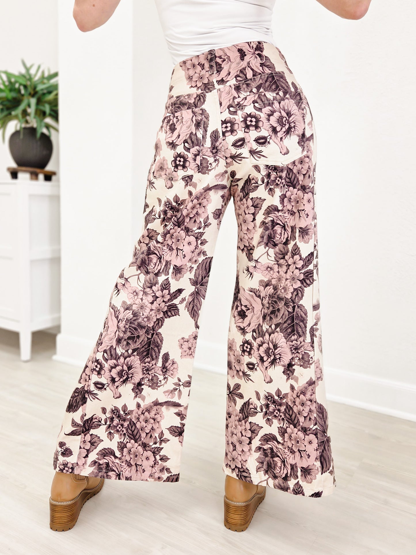 Wide Leg Pants Featuring Front Pockets With A Light Floral Design