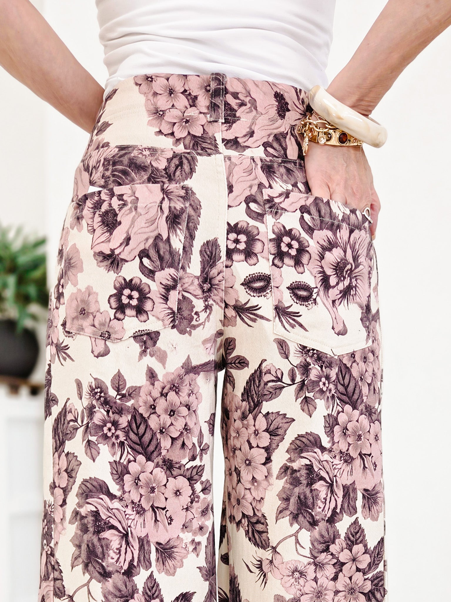 Wide Leg Pants Featuring Front Pockets With A Light Floral Design