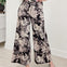 Wide Leg Pants Featuring Front Pockets With A Floral Design