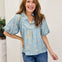 Short Puff Sleeve Top With A Ruffled Neckline And Notched V-Neck