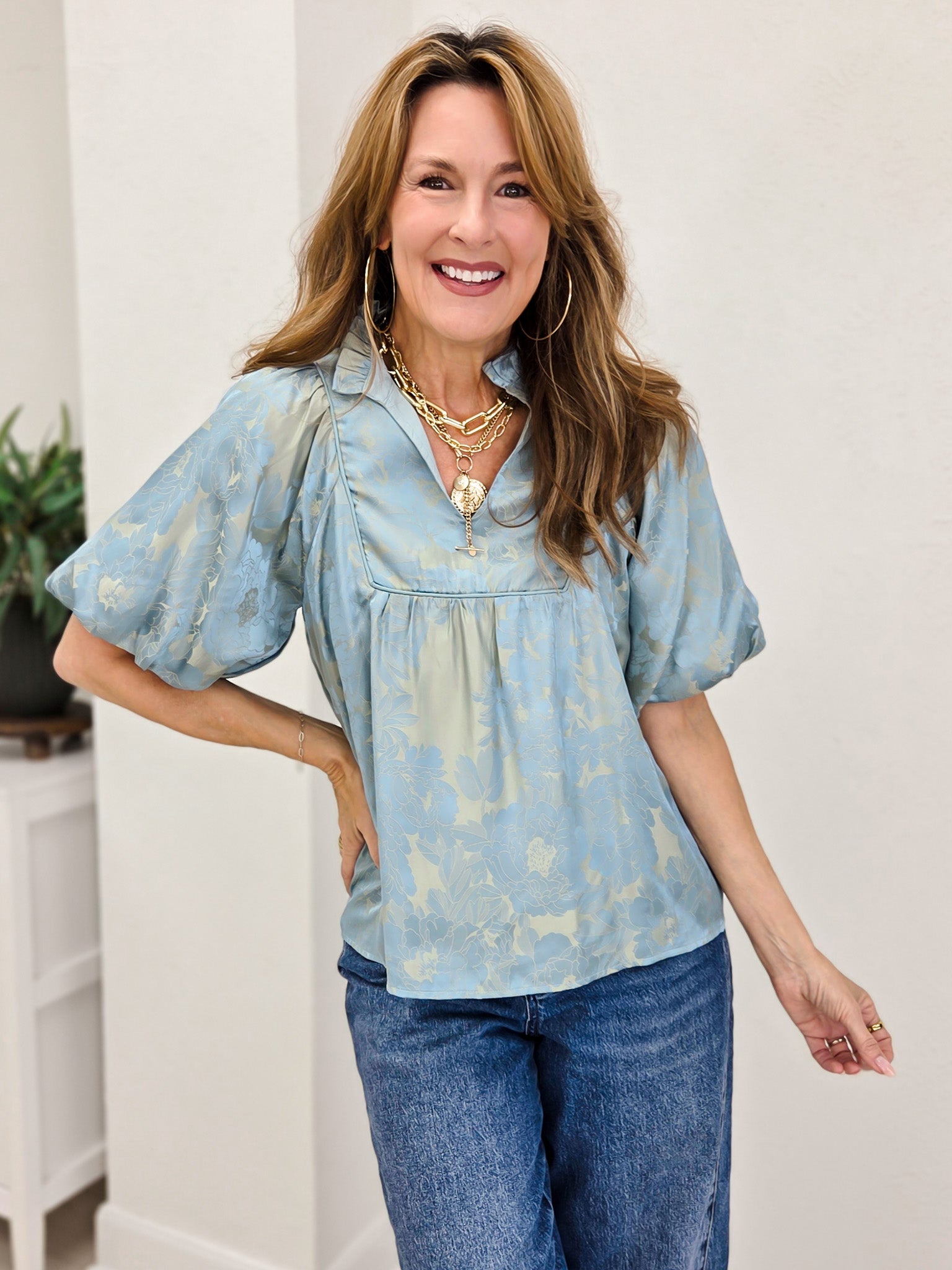 Short Puff Sleeve Top With A Ruffled Neckline And Notched V-Neck