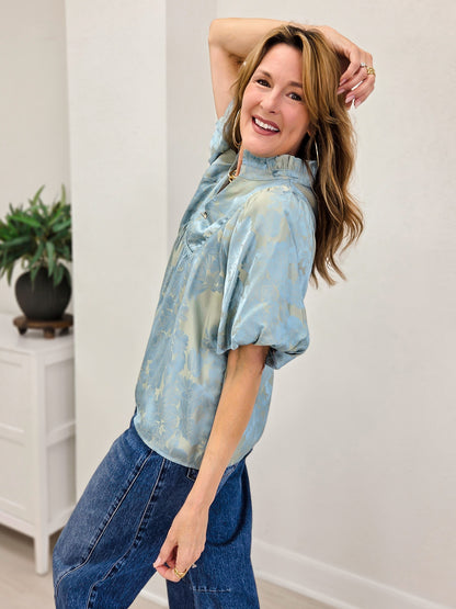 Short Puff Sleeve Top With A Ruffled Neckline And Notched V-Neck