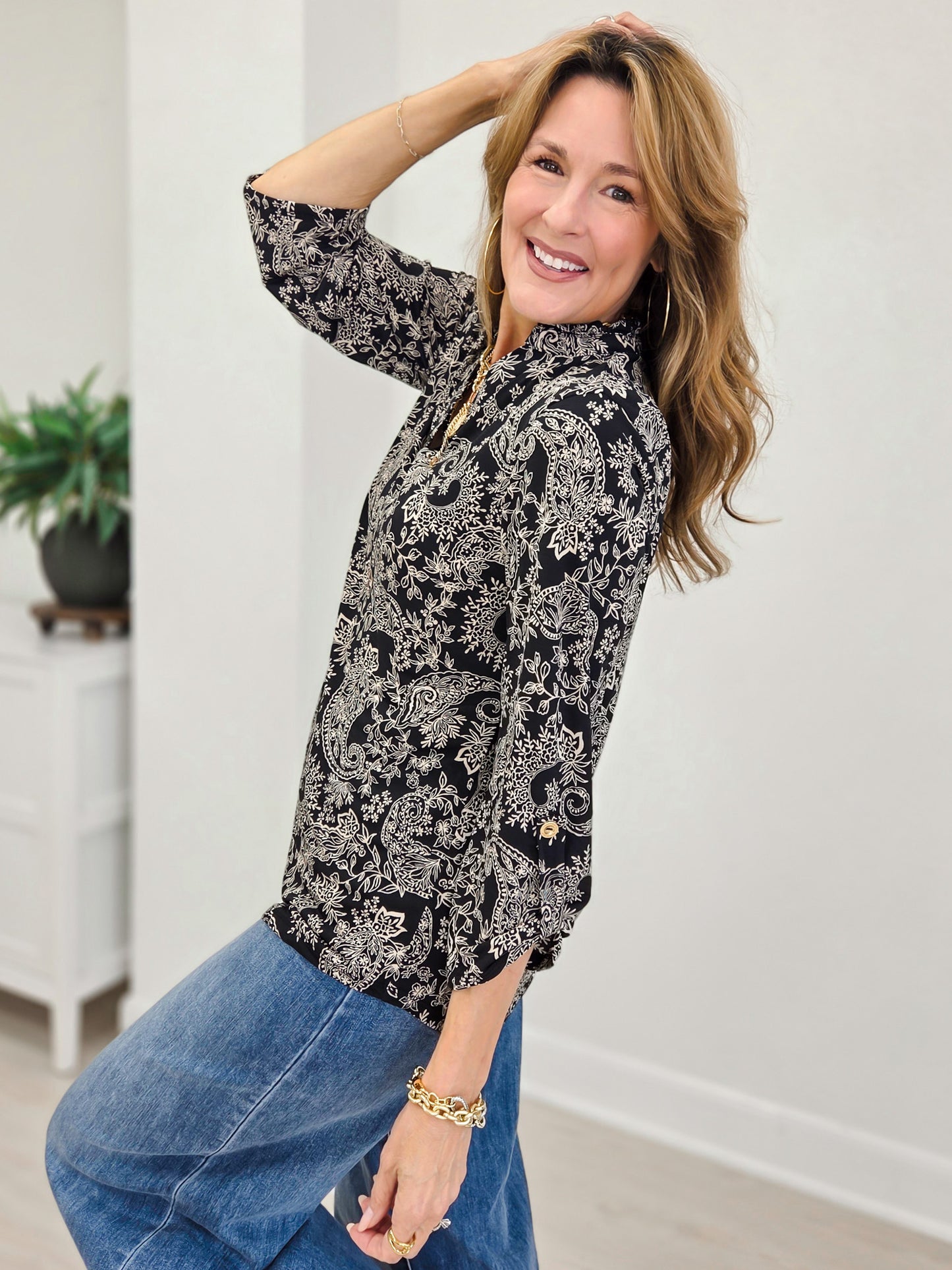 Patterned Bloluse With Ruffeled Neck Line And 3/4 Inch Sleeves
