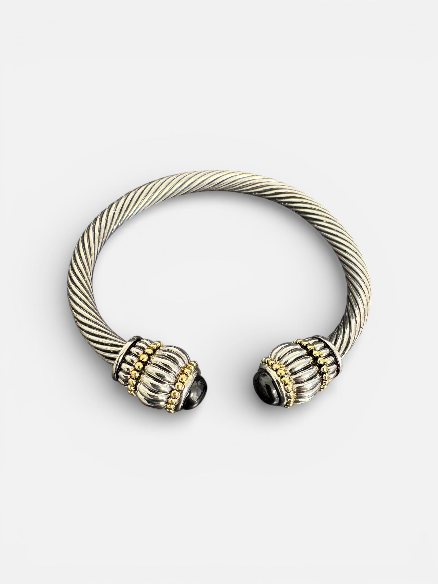 Silver Twisted Cable Cuff Bracelets with Gold and Black Stone Ends