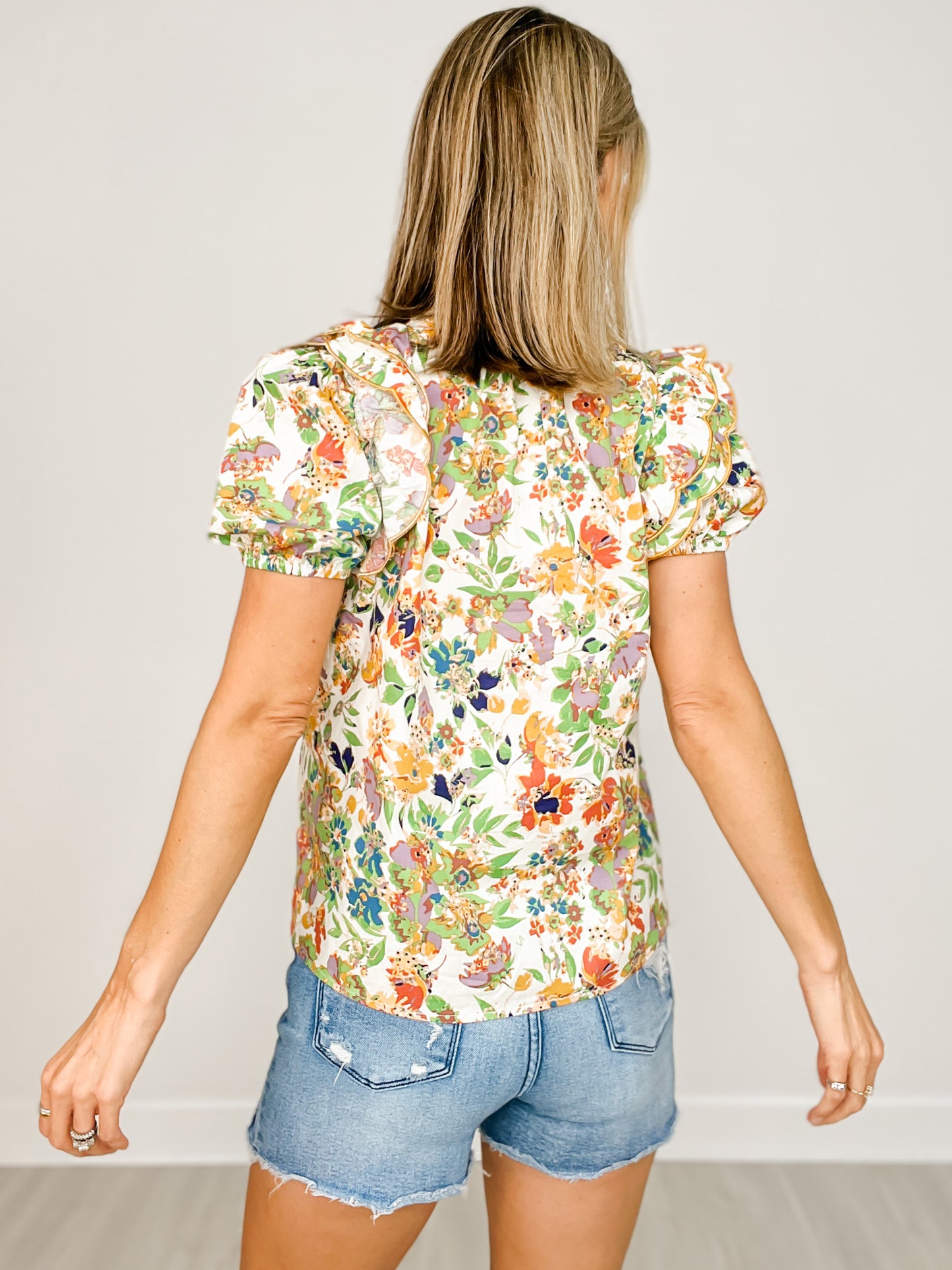 Floral Print Short Sleeve Ruffled Tie Neck Top