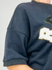 "Ready Hut" with Football Letter Patch Appliques on Oversized Top