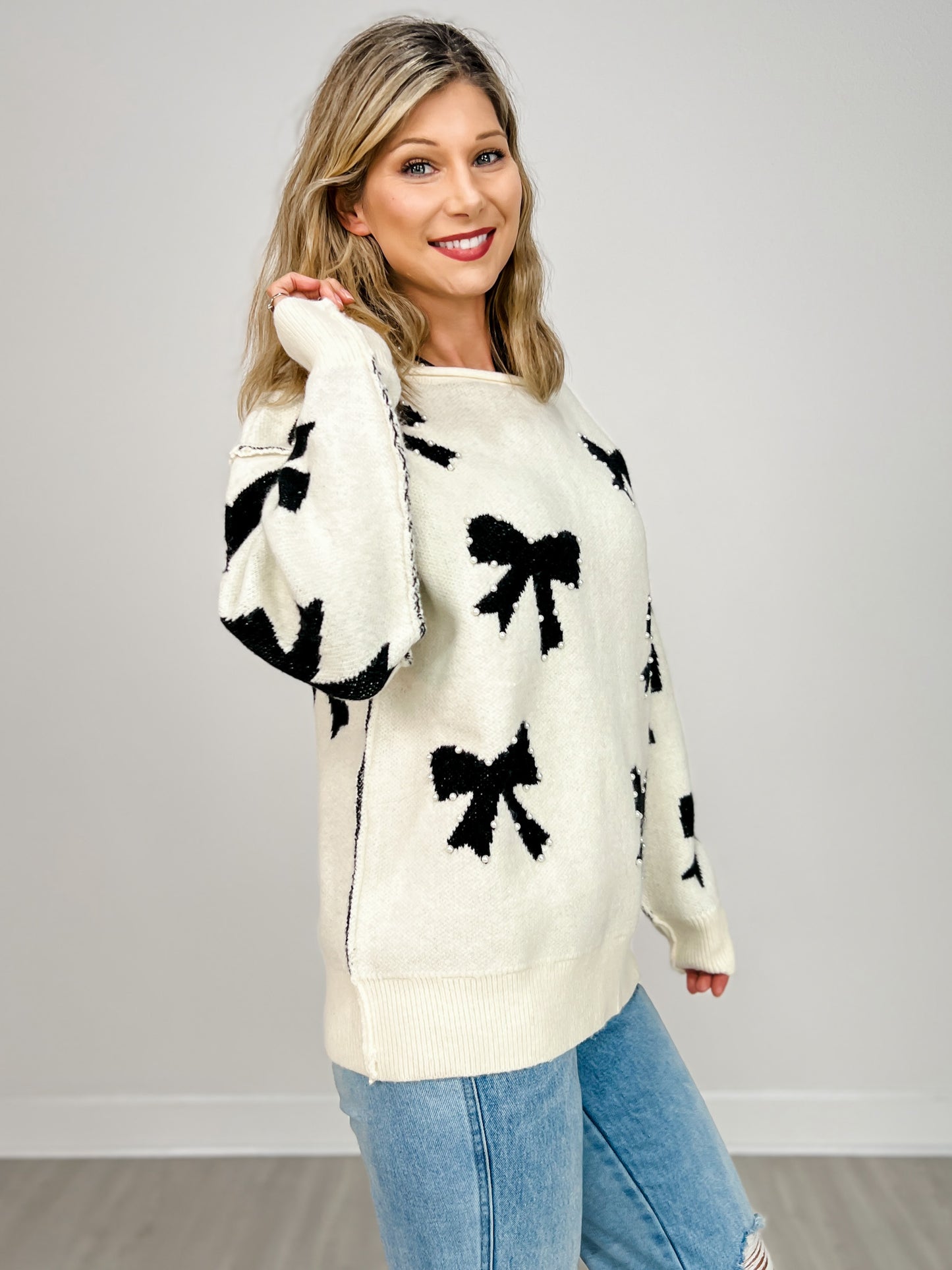 Long Sleeve Sweater with Knit Bows and Pearl Accents
