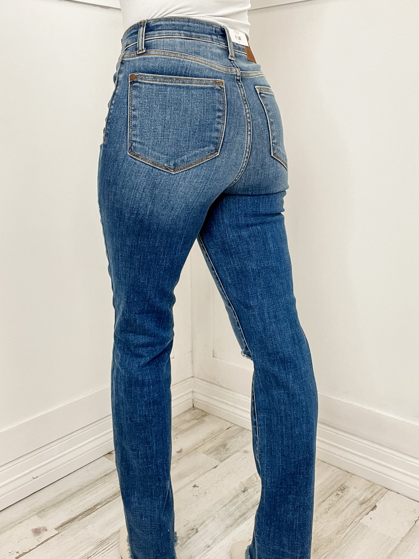 The Madison High Waist Distressed Knee and Fray Hem Straight Jean