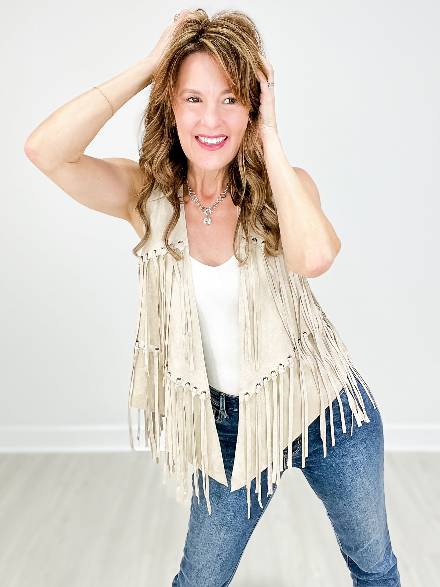 FRINGE VEST WITH EYELETS