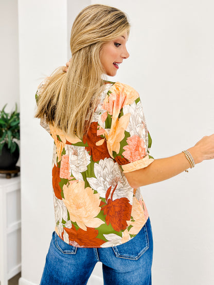 Floral Short Puff Sheeve Top Featuring a Smocked V Neck