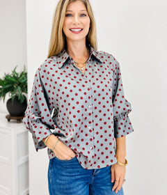 Polka Dot Long Sleeve Top Featuring A Button Closure