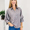 Polka Dot Long Sleeve Top Featuring A Button Closure
