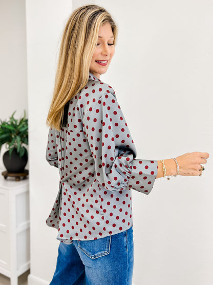 Polka Dot Long Sleeve Top Featuring A Button Closure