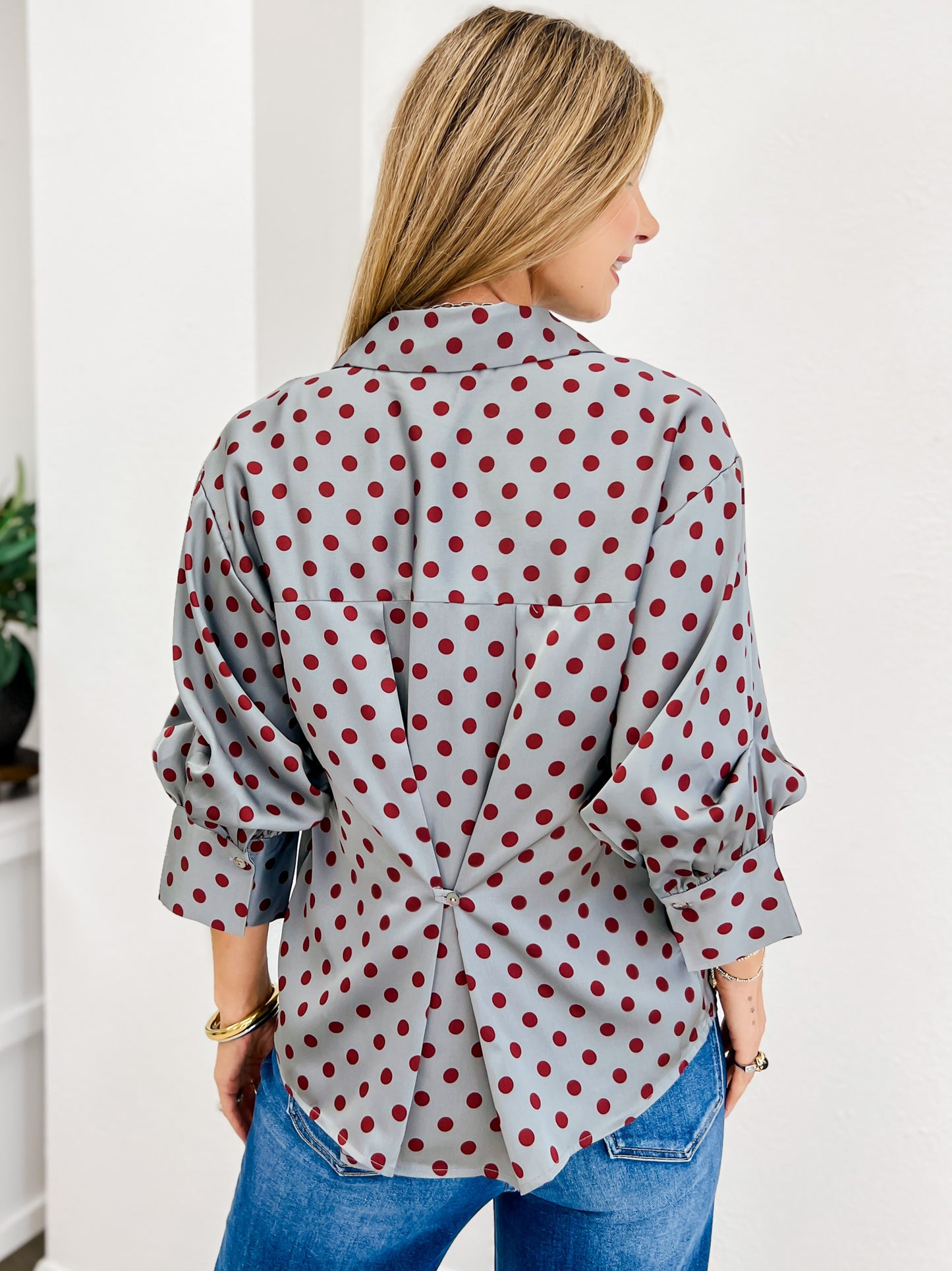 Polka Dot Long Sleeve Top Featuring A Button Closure