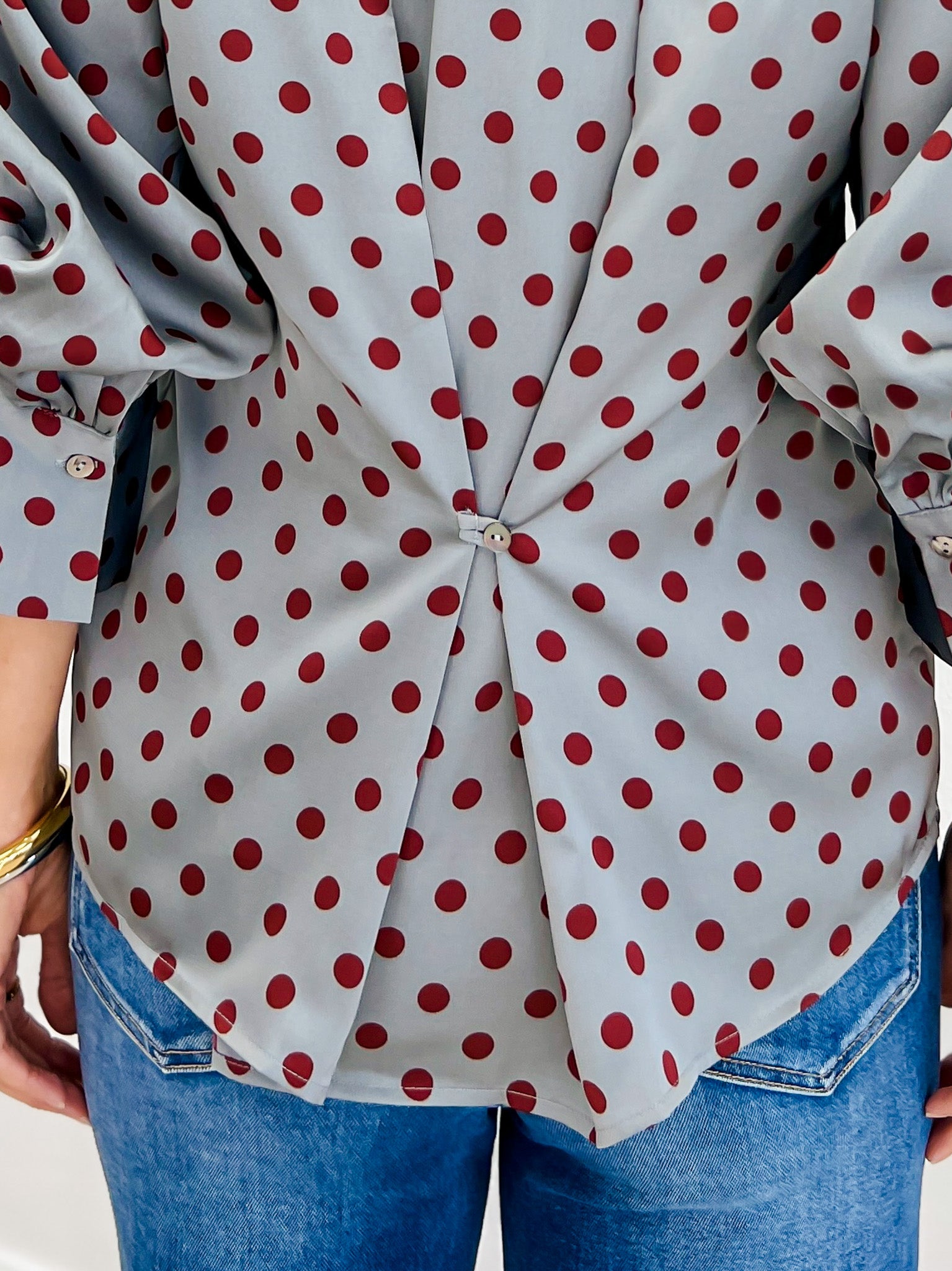 Polka Dot Long Sleeve Top Featuring A Button Closure