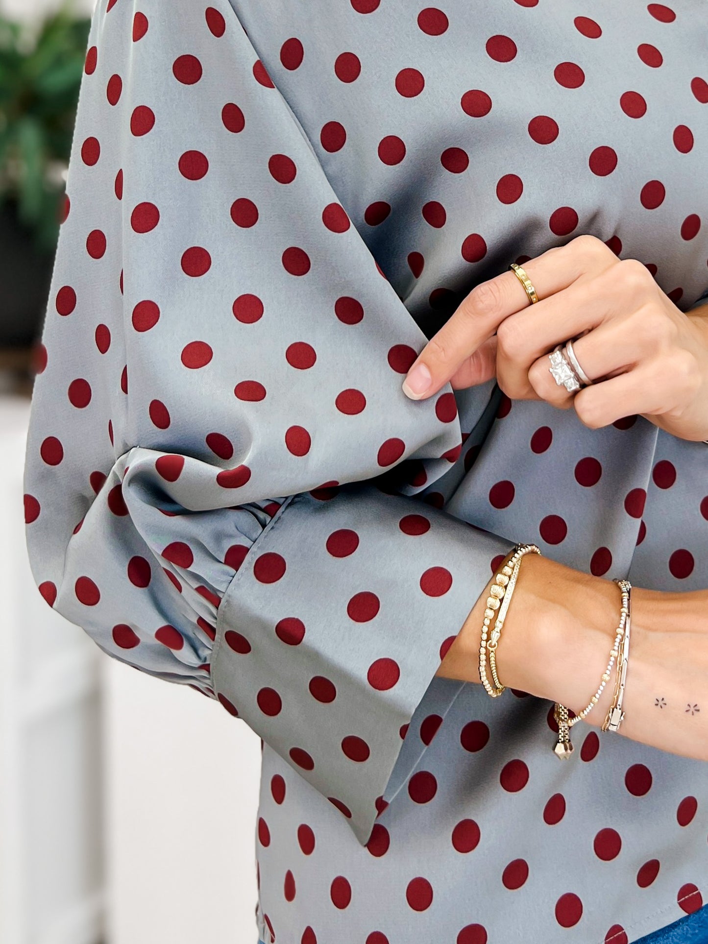 Polka Dot Long Sleeve Top Featuring A Button Closure