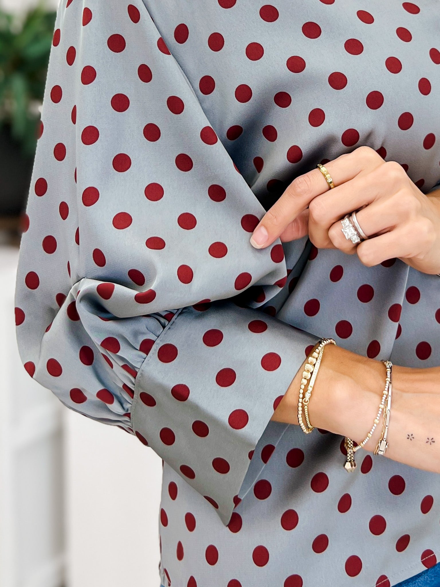 Polka Dot Long Sleeve Top Featuring A Button Closure