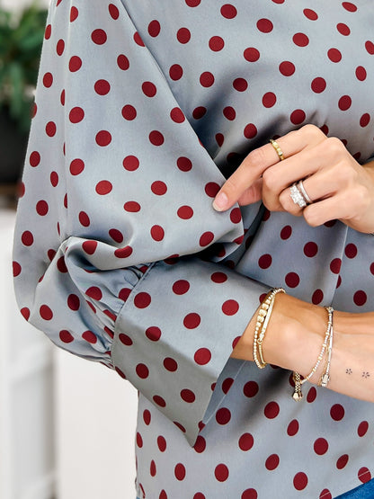 Polka Dot Long Sleeve Top Featuring A Button Closure