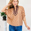 Polka Dot Short Dolman Sleeve Top Featuring A Contrast Collar