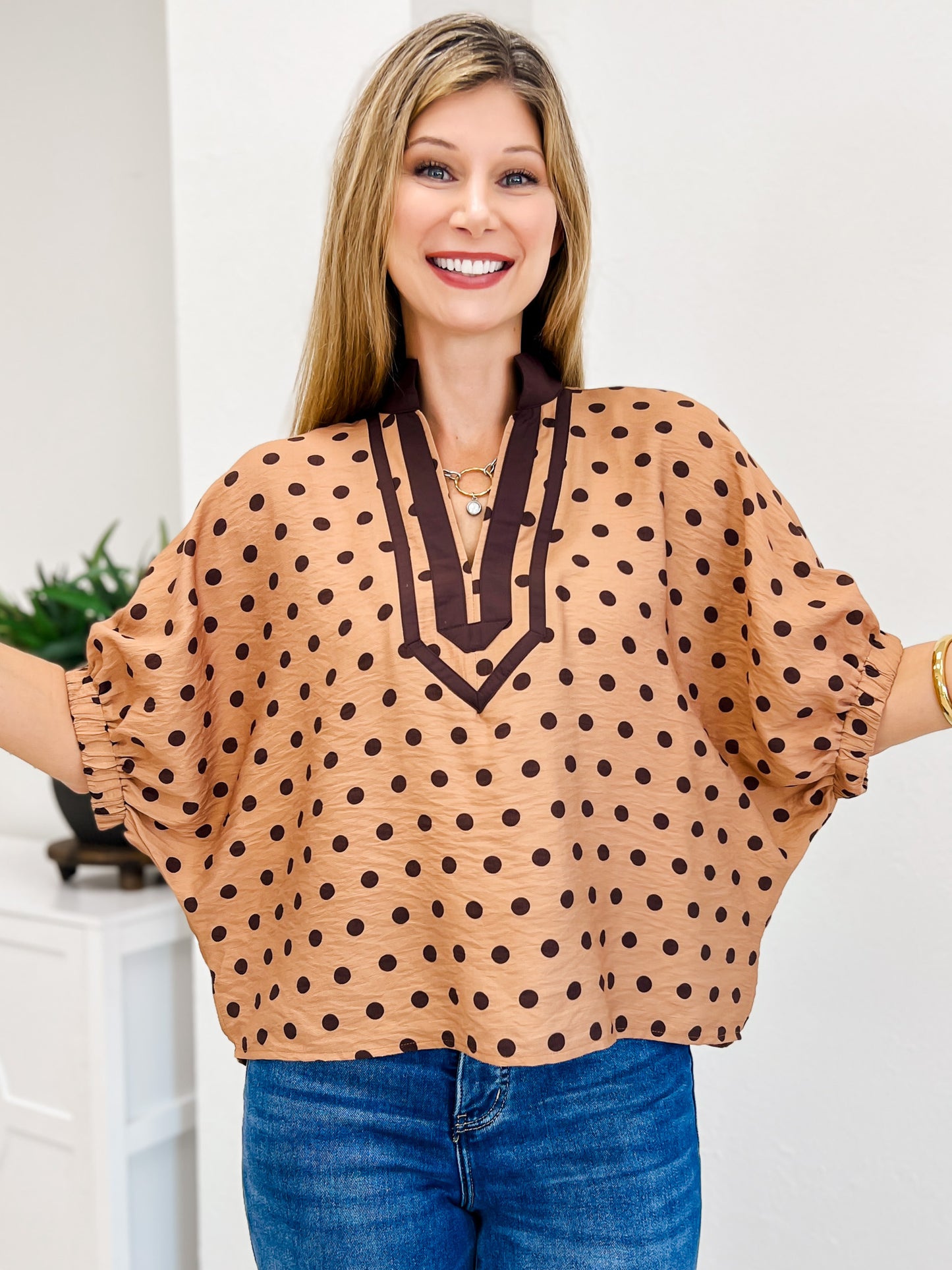 Polka Dot Short Dolman Sleeve Top Featuring A Contrast Collar
