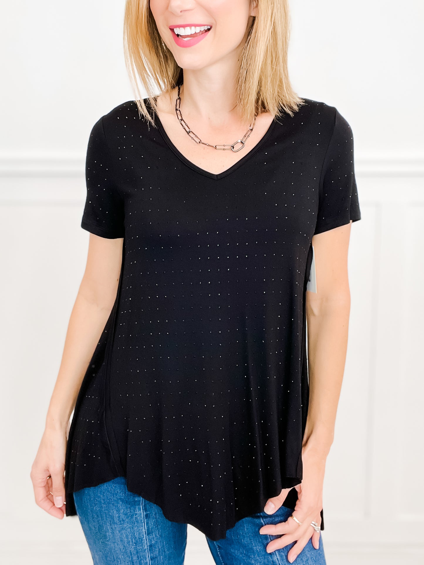 V NECK SHORT SLEEVE SHARKBITE HEM TOP WITH STUDS