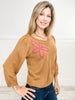 Three Quarter Sleeve Solid Knit Top with Embroidered Floral Accent
