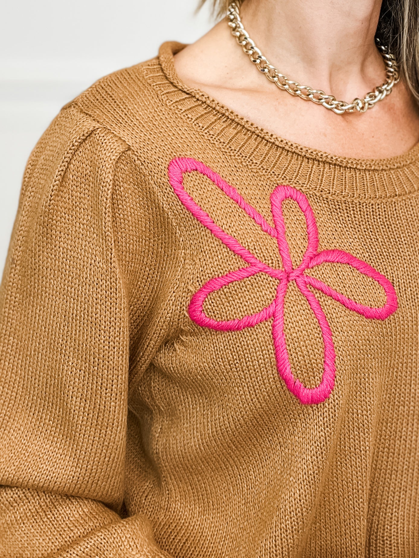 Three Quarter Sleeve Solid Knit Top with Embroidered Floral Accent