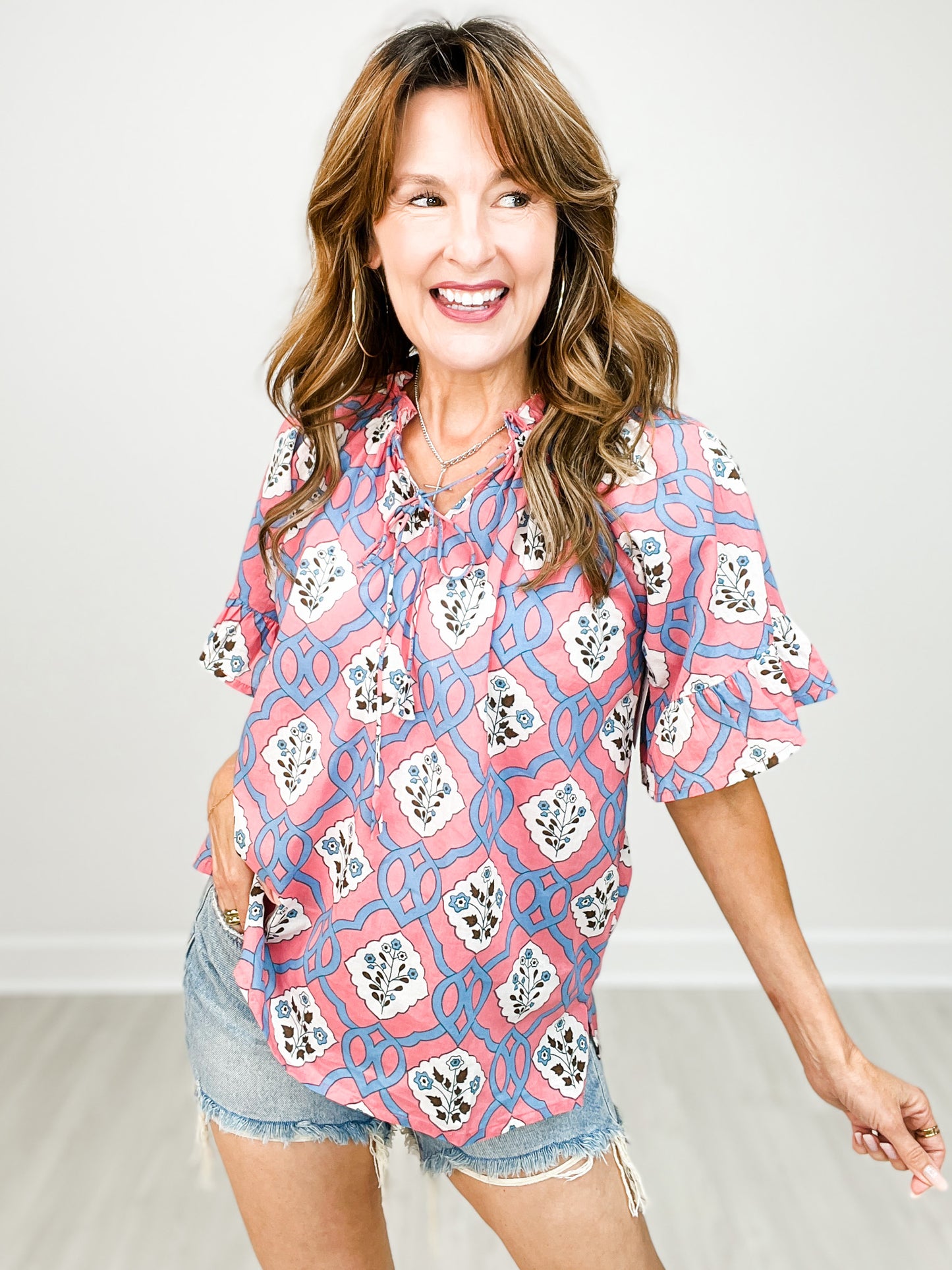 Patterned Top with Bell Sleeves and Tie Neckline