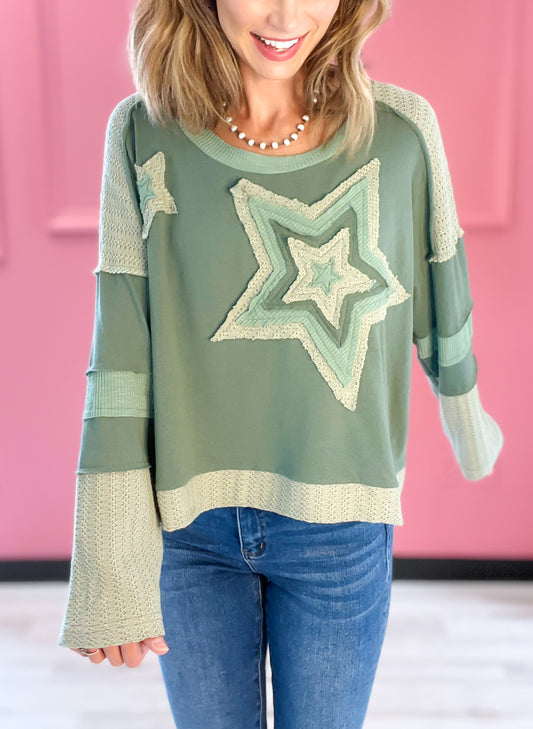 A Star Is Born Star Patch Long Sleeve Cropped Knit Top - A