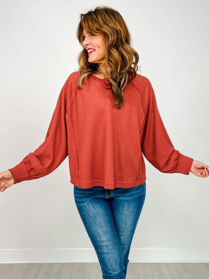 Long Sleeve Cropped Raglan Henley Top in Brick
